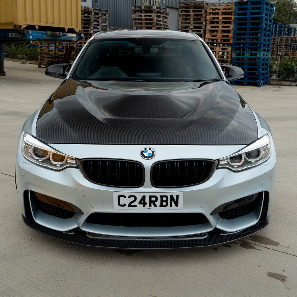 BMW M3 M4 F80 F82 F83 carbon fibre bonnet by CT Carbon, showing the sleek, lightweight hood with visible weave pattern.