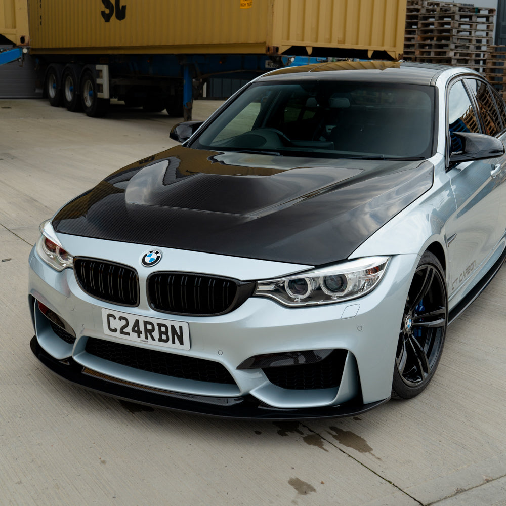BMW M3 M4 F80 F82 F83 carbon fibre bonnet by CT Carbon, showcasing the sleek, lightweight front hood with a textured carbon fiber finish.