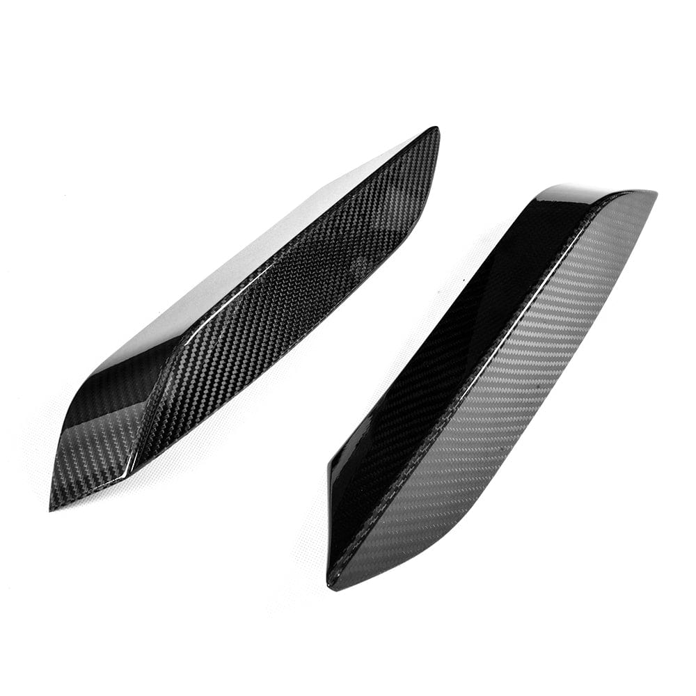 BMW M3 M4 F80 F82 F83 carbon fiber front canards, automotive accessories by CT Carbon, mounted on the front of the car.