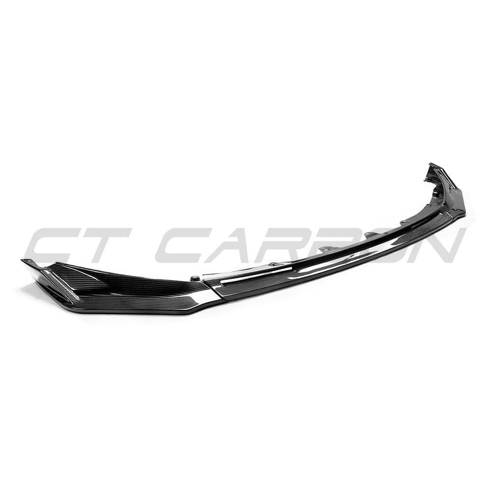 BMW M3 M4 G80 G82 carbon fiber front end kit by CT Carbon with aerodynamic accents, shown on a sporty front view.