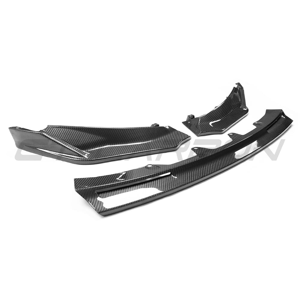 BMW M3 M4 G80 G82 carbon fibre front end kit by CT Carbon, showcasing the aerodynamic design and carbon fibre details.