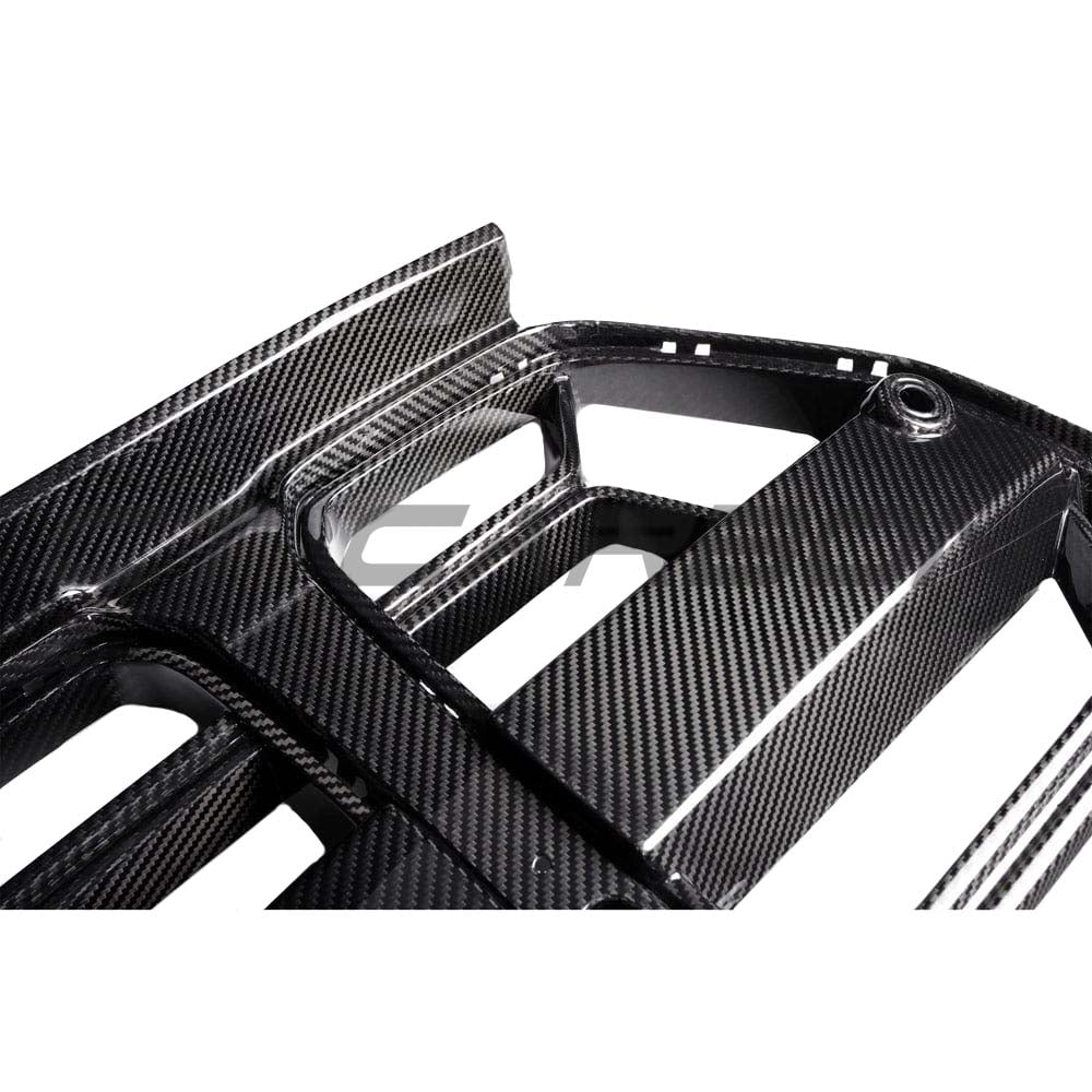 BMW M3 M4 G80 G82 G83 carbon fibre front end pack by CT Carbon, showing the sleek carbon fibre grille and sporty front design.