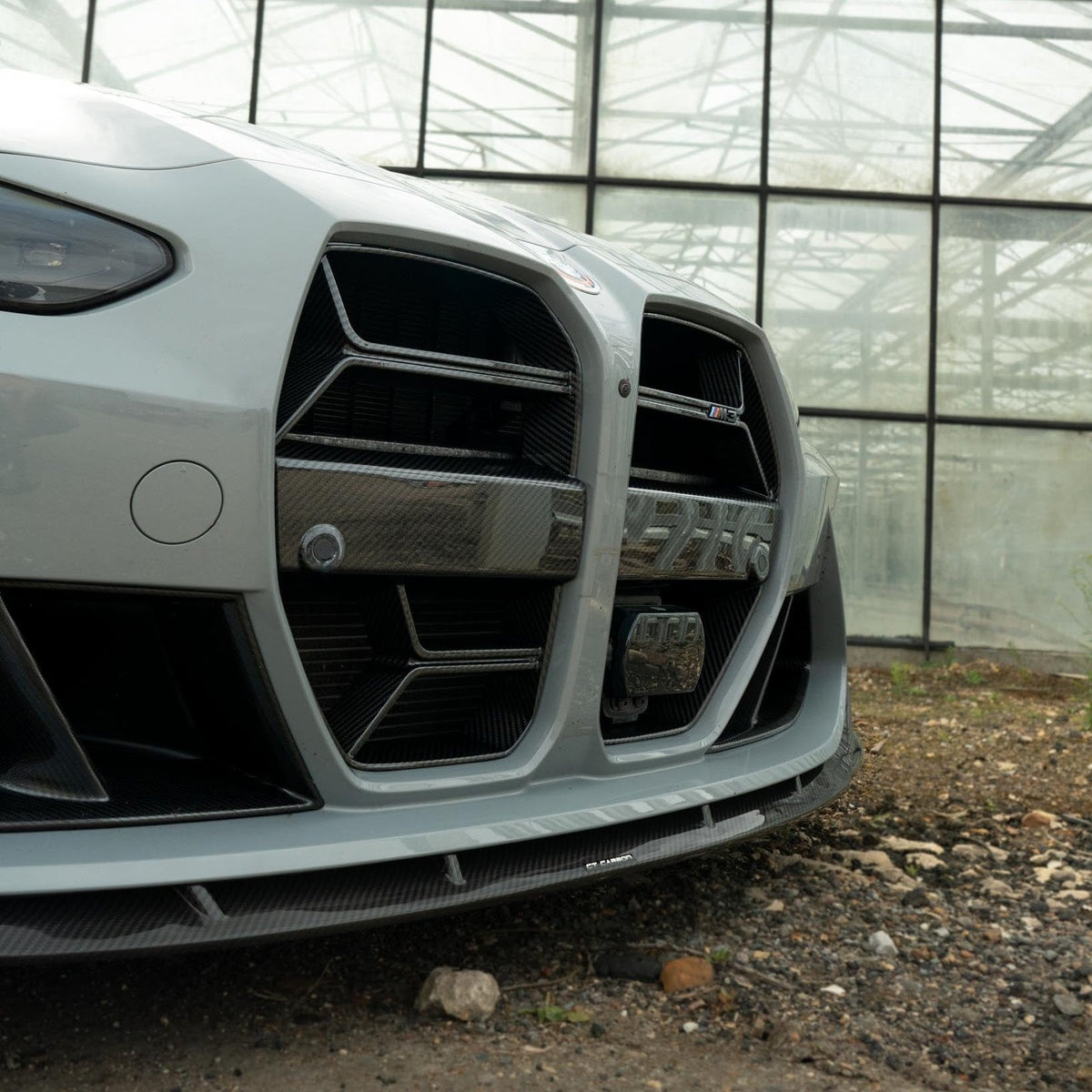 BMW M3 M4 G80 G82 G83 carbon fiber grille by CT Carbon with ACC, featuring a sleek, lightweight design and detailed mesh pattern.