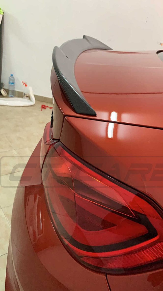BMW M4 F82 carbon fibre spoiler in CS style by CT Carbon, showcasing its sleek, aerodynamic design on the vehicle.