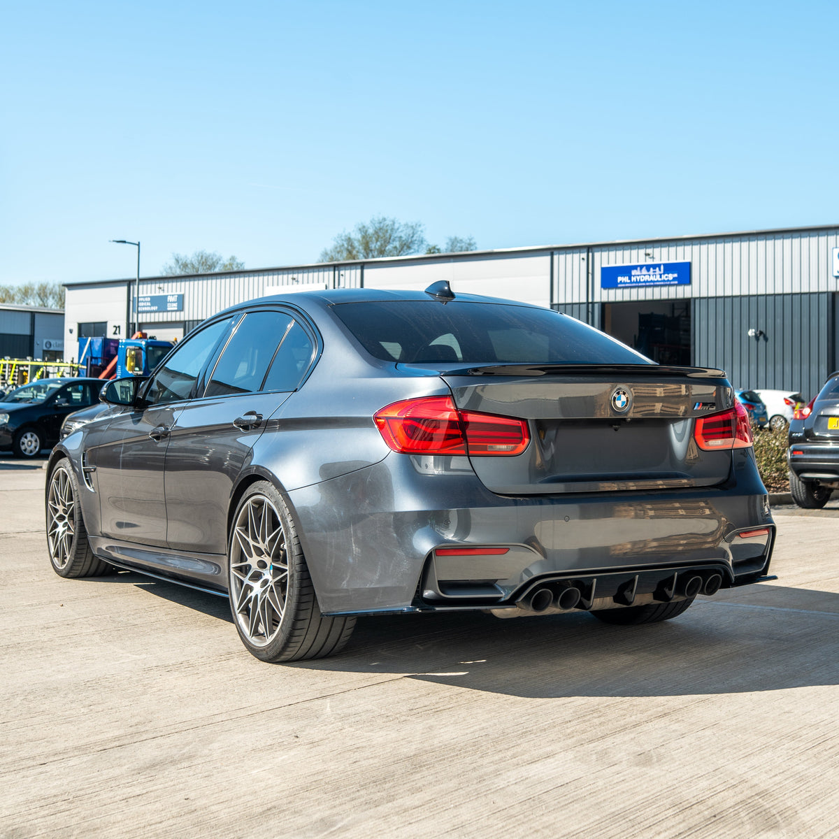 BMW 3 Series F30 GLOSS BLACK spoiler by CT Carbon, rear view showing sleek, aerodynamic design on a coupe.