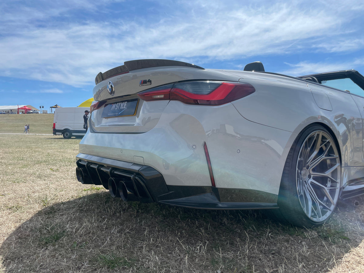 BMW M4 G83 full carbon fibre kit by CT Carbon, including front and rear parts, shown on a sleek sports car.