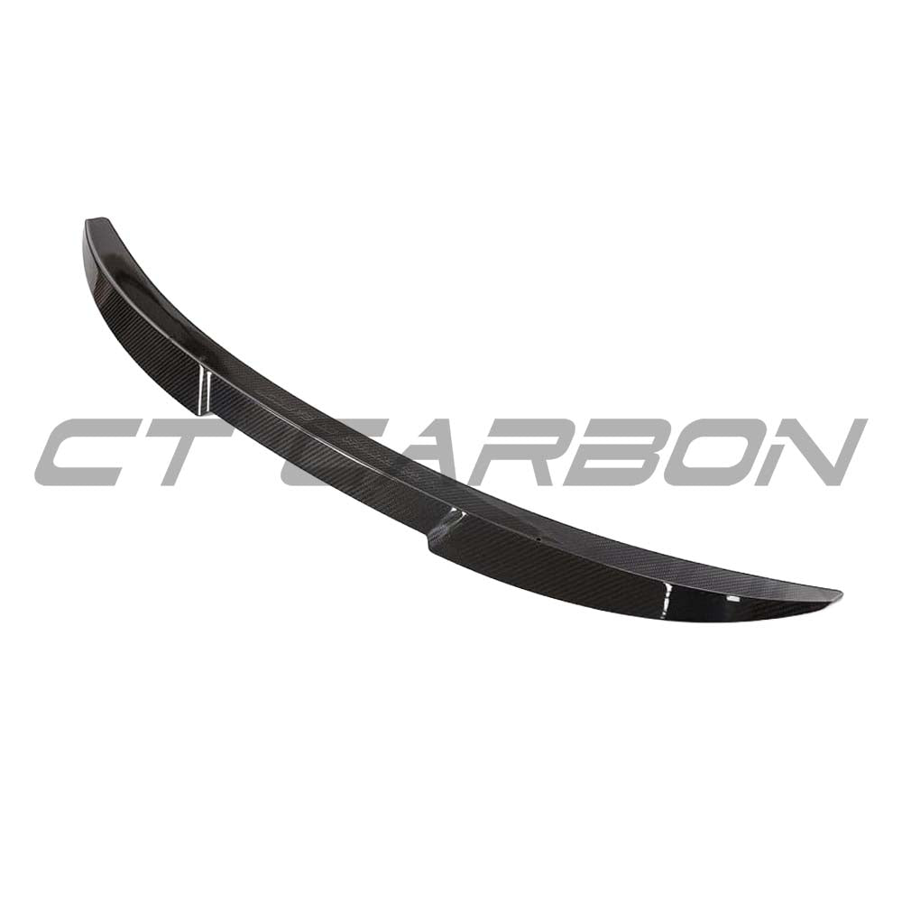 BMW G82 M4 full carbon fiber kit by CT Design, featuring carbon fiber spoiler and body components on a sleek sports car.