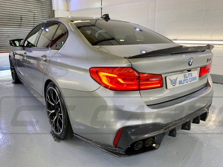 BMW M5 F90 and G30 5 Series carbon fiber spoiler by CT Carbon, featuring a sleek ducktail design for sporty enhancement.