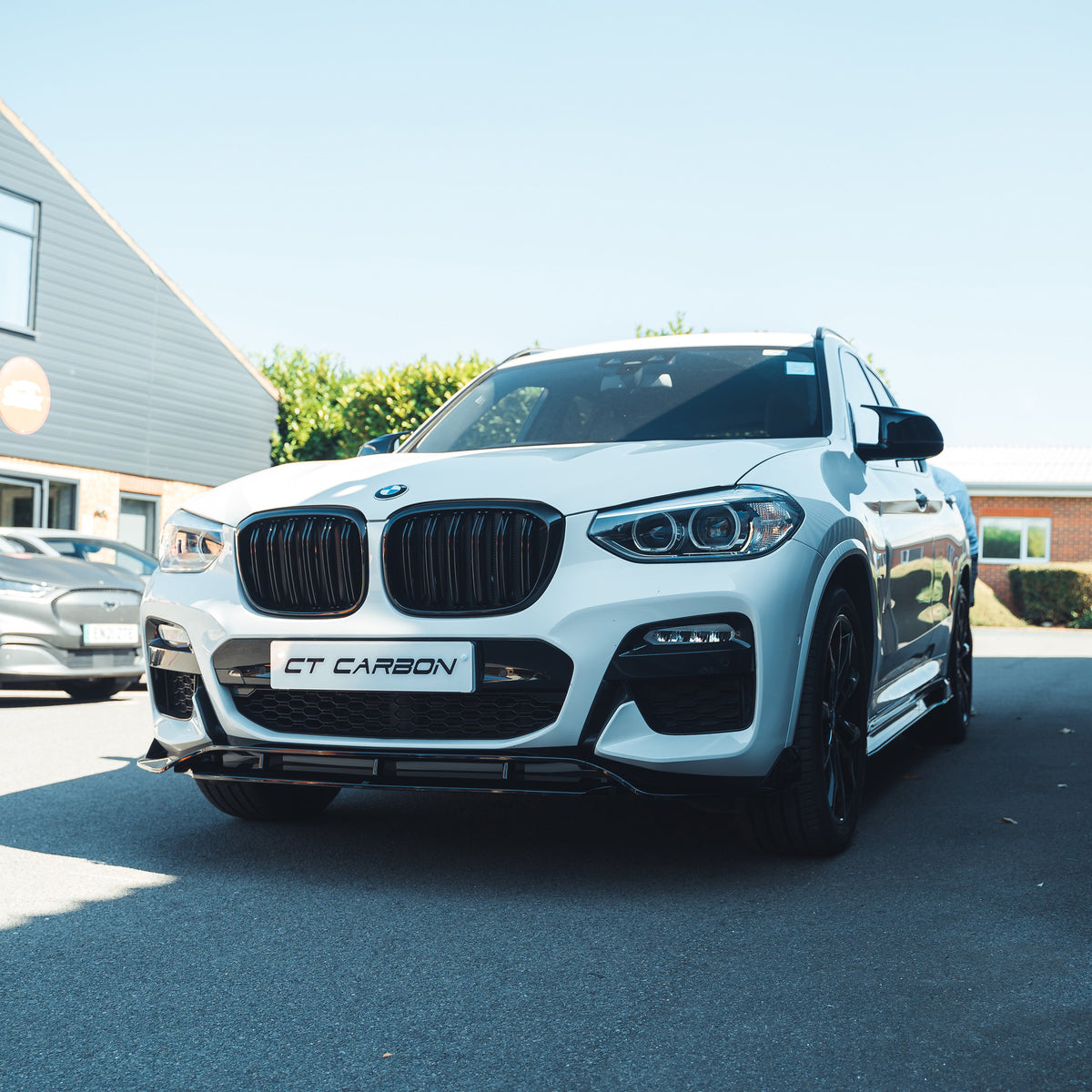 BMW X3 G01 2017-2020 CT Carbon full gloss black kit with tips, featuring car exterior accessories and black accents.