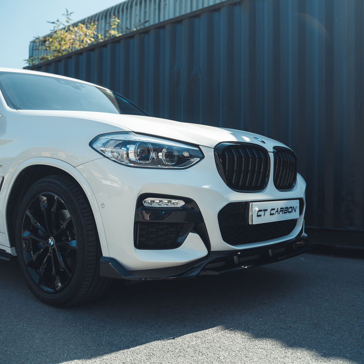 BMW X3 G01 2017-2020 full gloss black kit with tips by CT Carbon, featuring sleek black exterior components and exhaust tips.