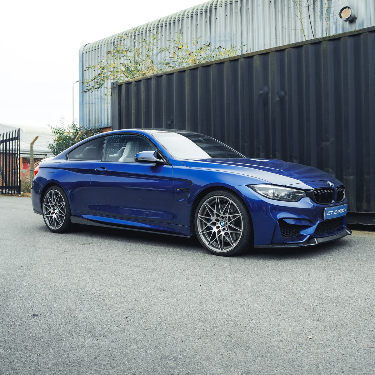 BMW M3 M4 F80 F82 carbon fibre side skirts by CT Carbon, showing sleek, lightweight aerodynamic design for sporty look.