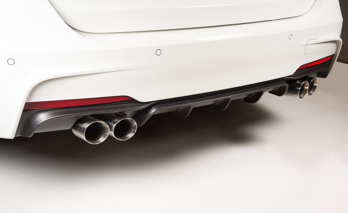 Cobra Sport BMW 325D F30 LCI quad exit M3 style performance exhaust conversion on F31 Tourer, showcasing the quad exhaust tips.