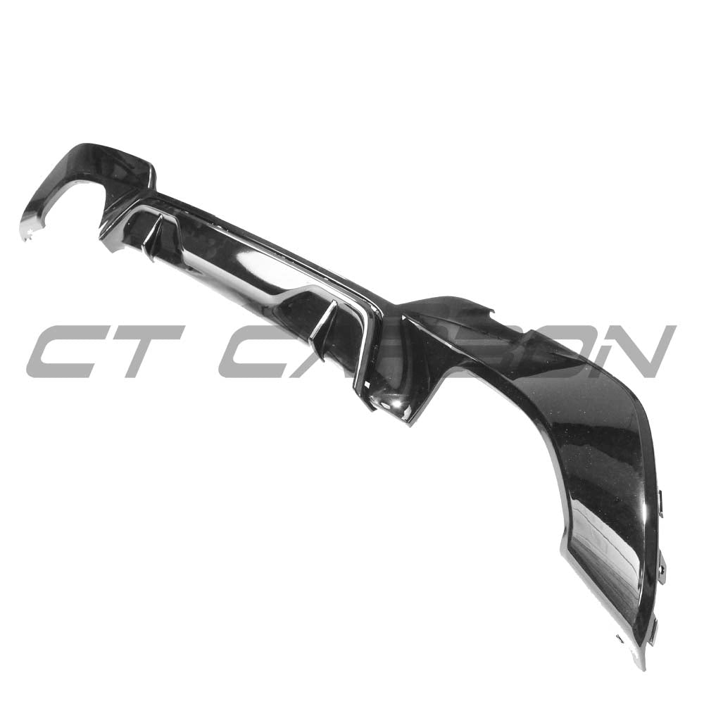 BMW G20 G21 3 Series CT Carbon gloss black diffuser with quad tips, showcasing sleek automotive styling against a neutral background.