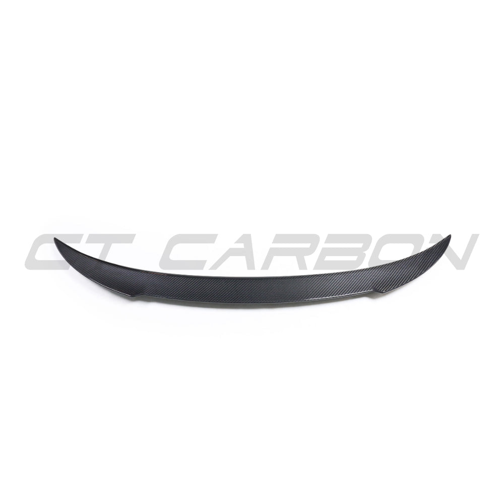 BMW 8 Series M8 G16/F93 carbon fiber spoiler by CT Carbon, showcasing sleek aerodynamic design on a sports car.