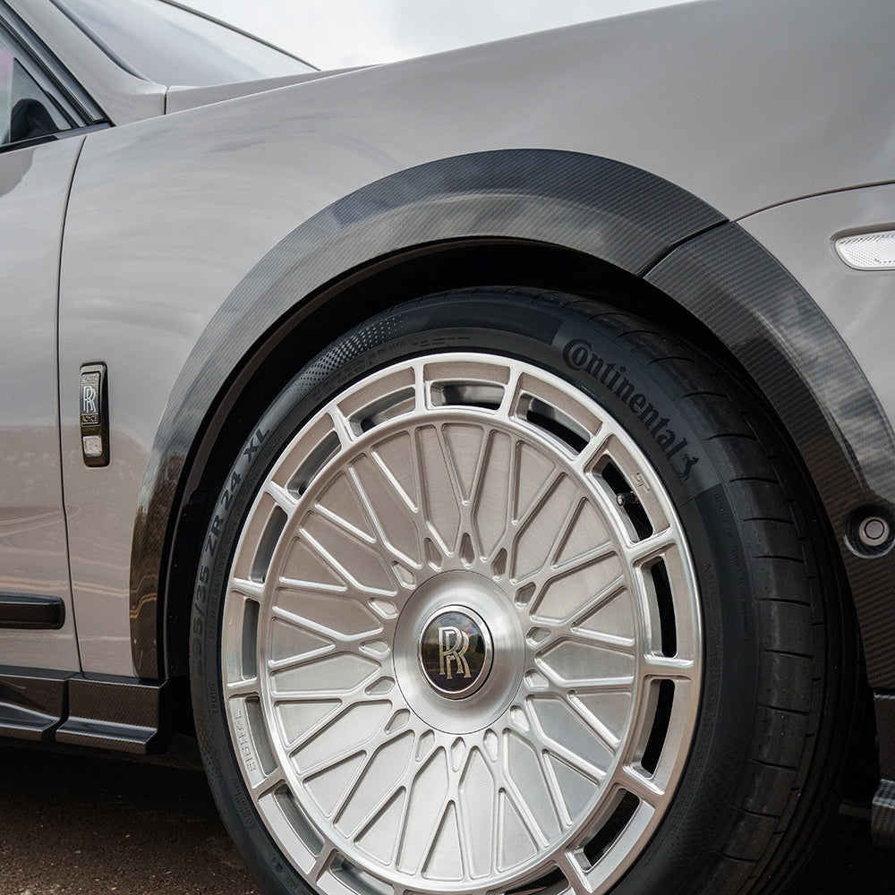 CT Carbon splitters for Rolls Royce Cullinan carbon fiber wheel arch extensions, showcasing sleek, aerodynamic design details.