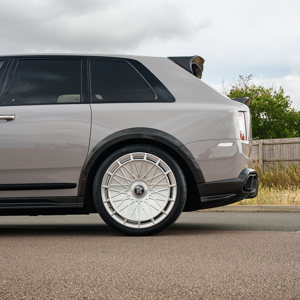 CT Carbon splitters for Rolls Royce Cullinan carbon fiber wheel arch extensions, featuring sleek, aerodynamic design.