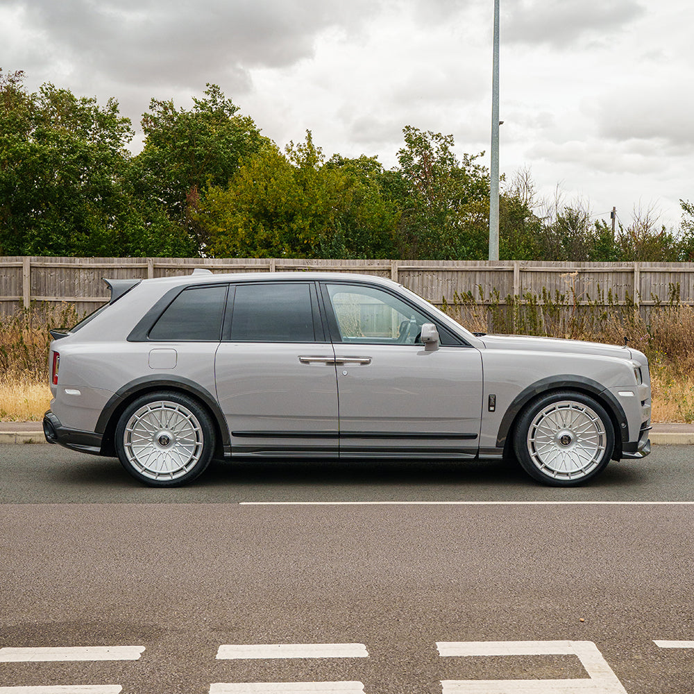 CT Carbon splitters for Rolls Royce Cullinan carbon fiber wheel arch extensions, shown on the luxury vehicle.
