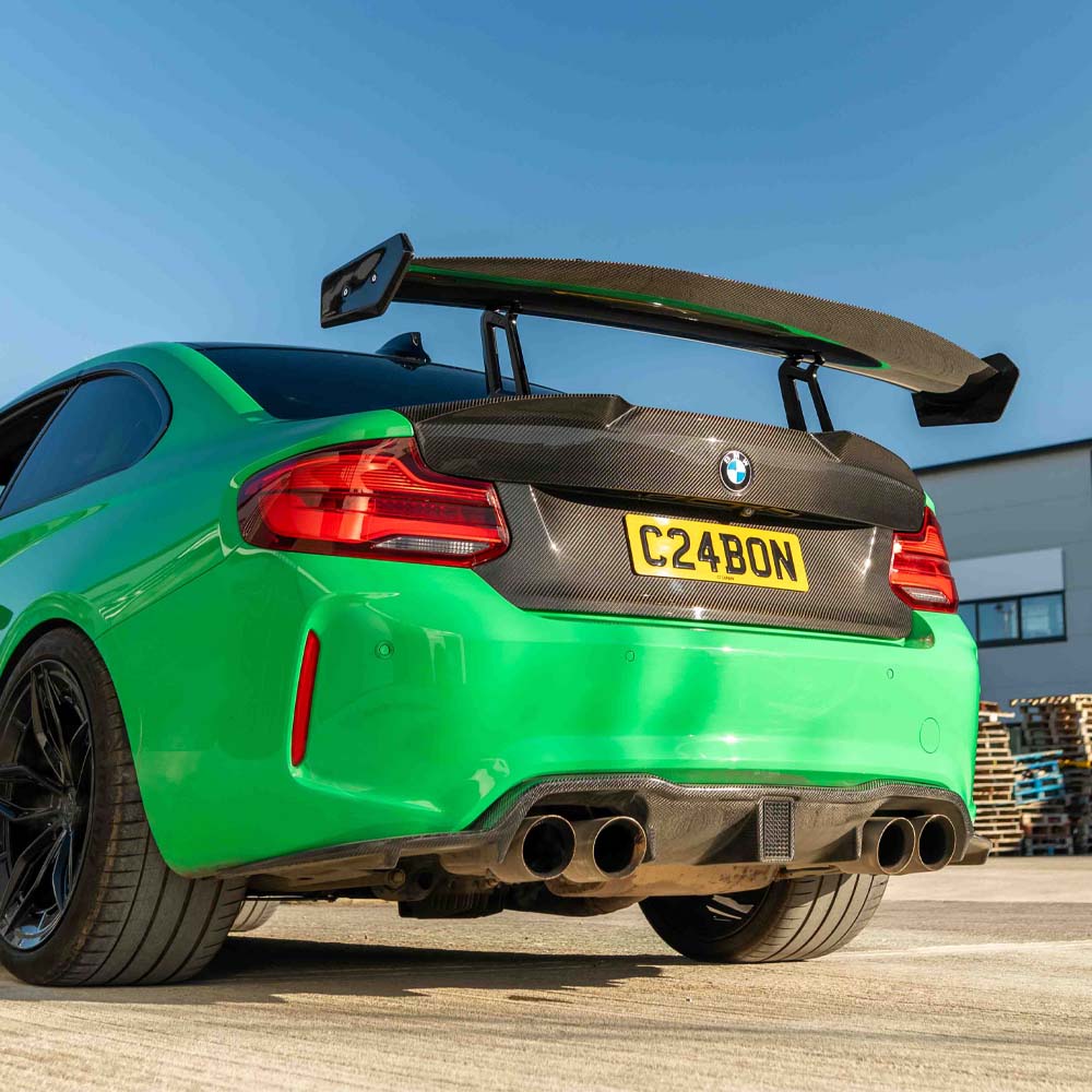 BMW F87 M2 carbon fiber full car kit by CT Carbon, including various exterior parts, shown on the vehicle.