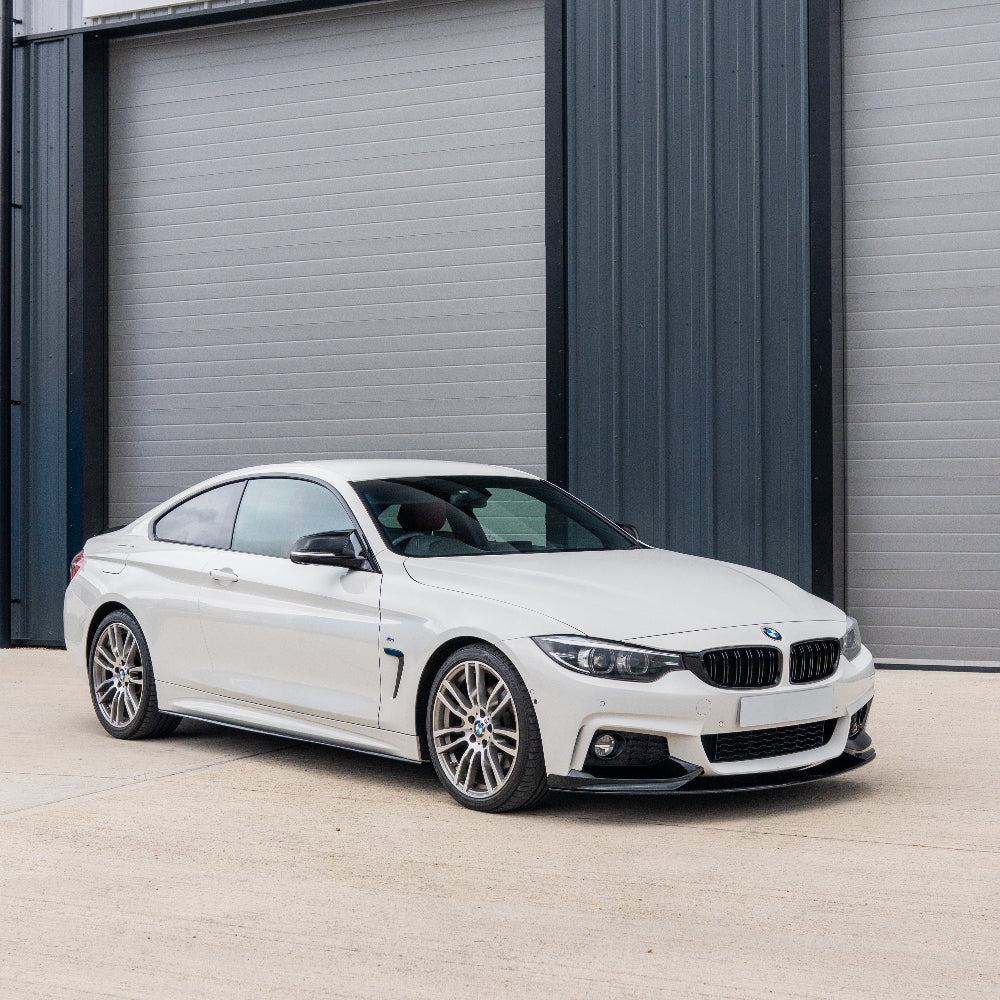 Black double slat grille for BMW M4 F82/F83 and 4 Series F32/F33/F36 by CT Carbon, shown on a vehicle.