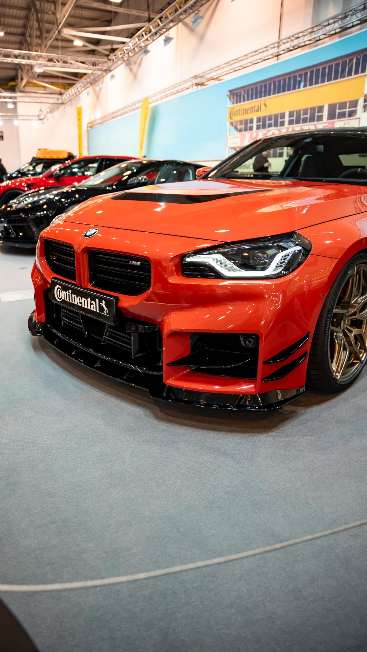 AC Schnitzer BMW M2 G87 front splitter installed on the vehicle, showcasing a sleek aerodynamic enhancement for the front bumper.