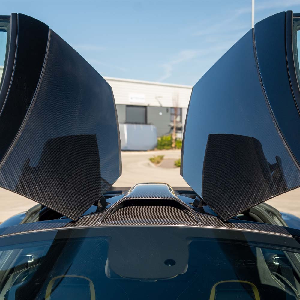 CT Carbon McLaren 720S Ultimate Kit, car kit with carbon fiber accents, shown on a sleek McLaren 720S supercar.