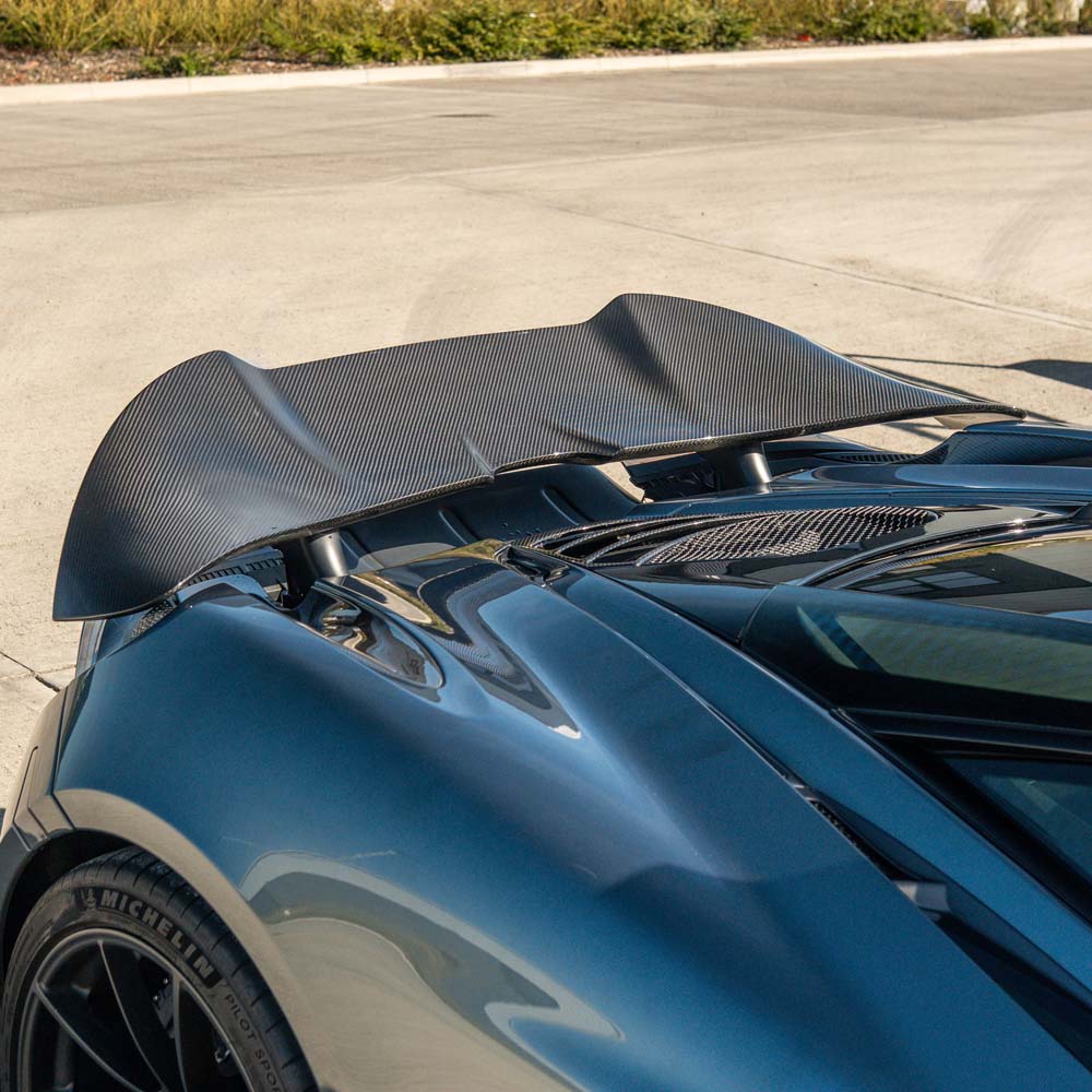 CT Carbon McLaren 720S Ultimate Kit displayed on a car, showcasing custom aerodynamic components and carbon fiber details.