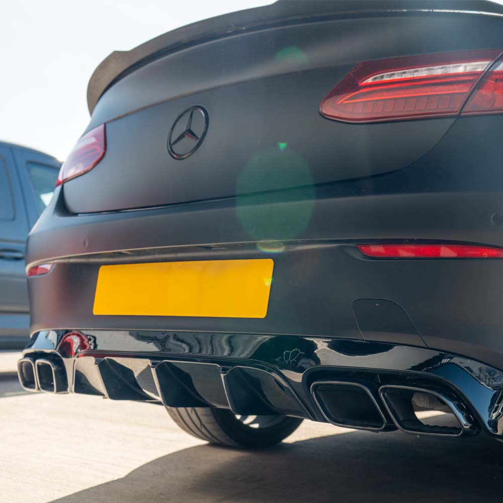 CT Carbon Mercedes C238 2017-2020 E-Class Coupe quad tip diffuser showing sleek black carbon fiber design and exhaust cutouts.