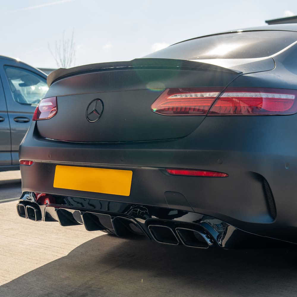 CT Carbon Mercedes C238 2017-2020 E-Class Coupe quad tip diffuser showing sleek black carbon fiber finish and exhaust cutouts.