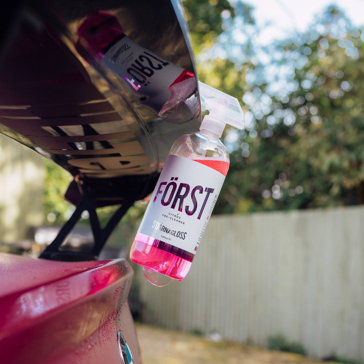 StjarnaGloss Först Citrus Pre-Cleaner protective rinse aid bottle with citrus scent and label, designed for pre-cleaning surfaces.