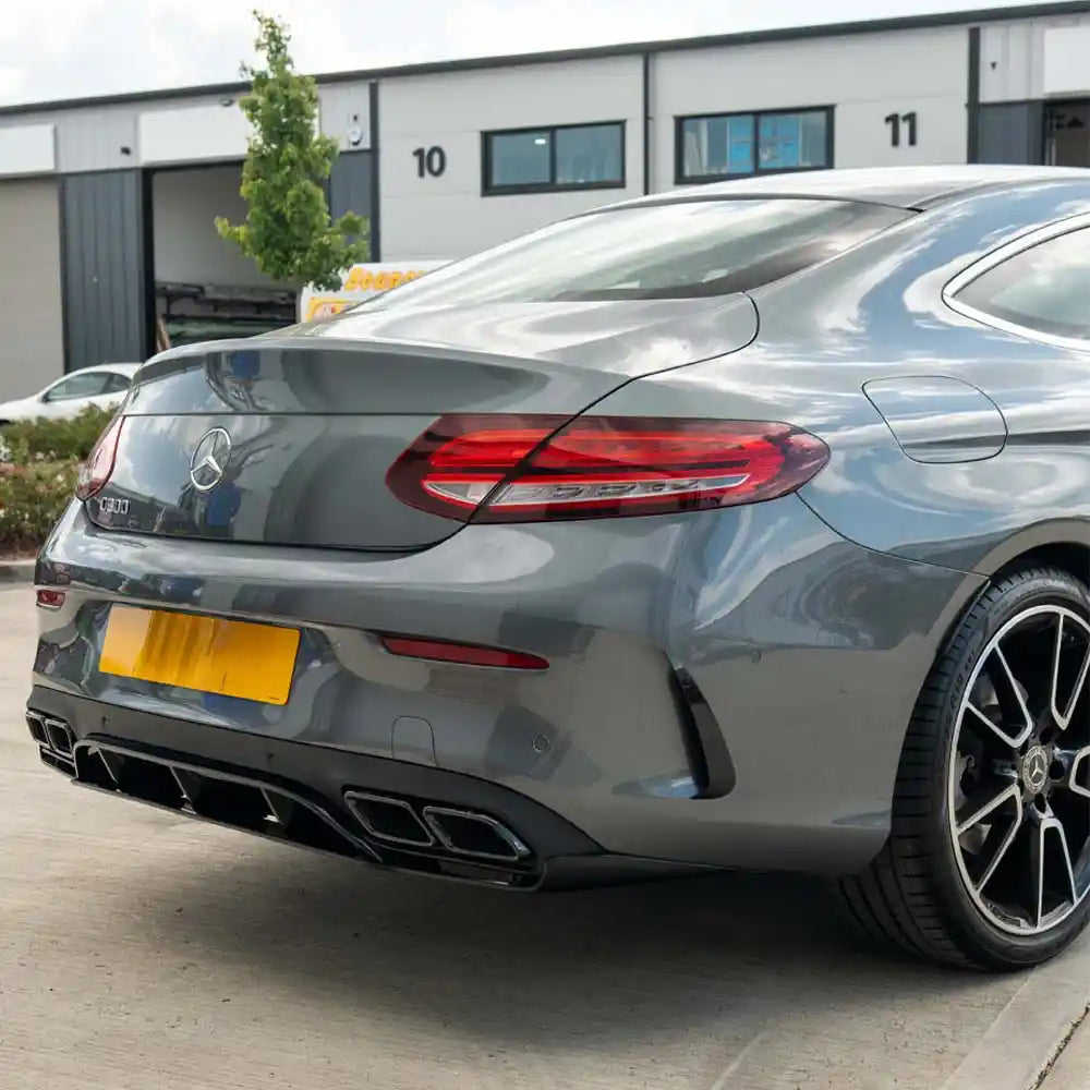 CT Carbon Mercedes C-Class W205 coupe gloss black diffuser with black tips, showcasing sleek, aerodynamic design and high-quality finish.