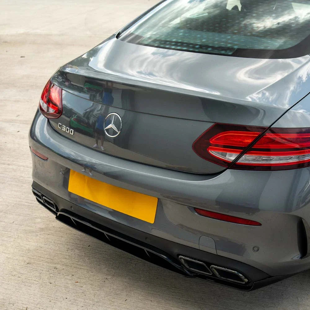 CT Carbon Mercedes C-Class Coupe W205 gloss black diffuser with black tips, showing detailed aerodynamic design and sleek finish.