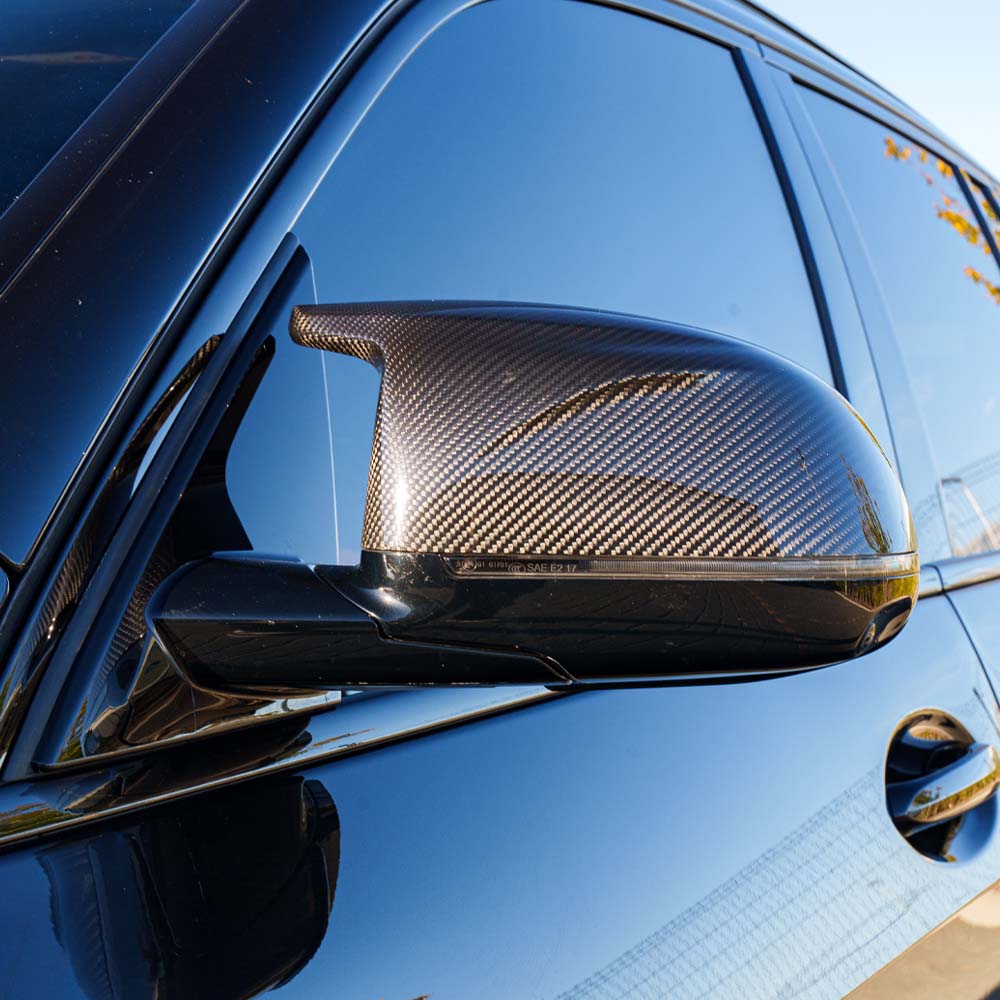 BMW G05 X5 LCI 2023 full carbon fibre kit by CT Carbon, showing panels and parts in a sleek, high-quality finish.
