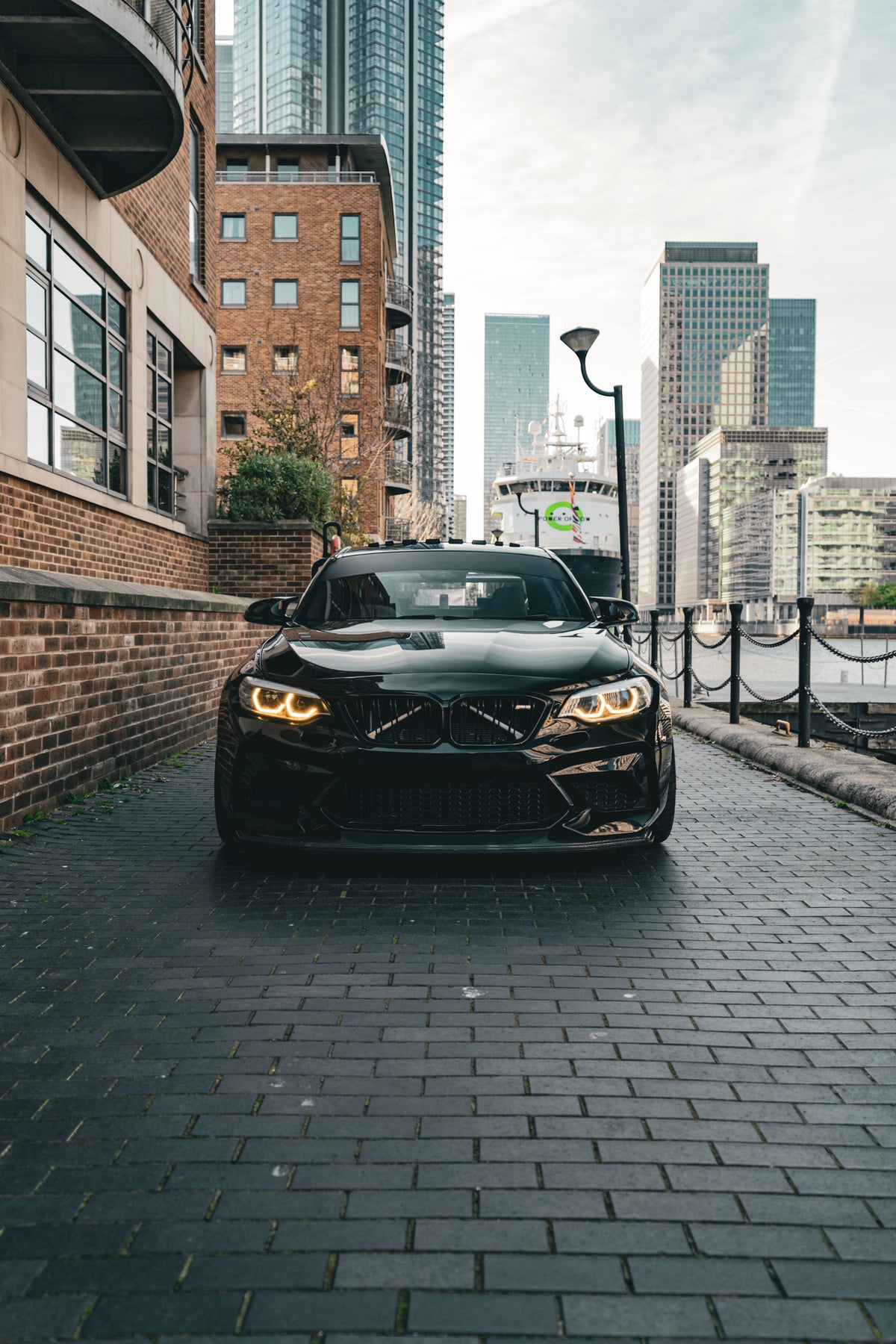 Carbon GTS front splitter for BMW M2 Competition by 72Design, showing the sleek aerodynamic design and mounting details.
