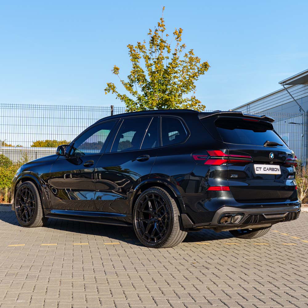 BMW G05 X5 LCI 2023 full carbon fiber kit by CT Carbon, showing detailed close-up of carbon fiber components on the car.