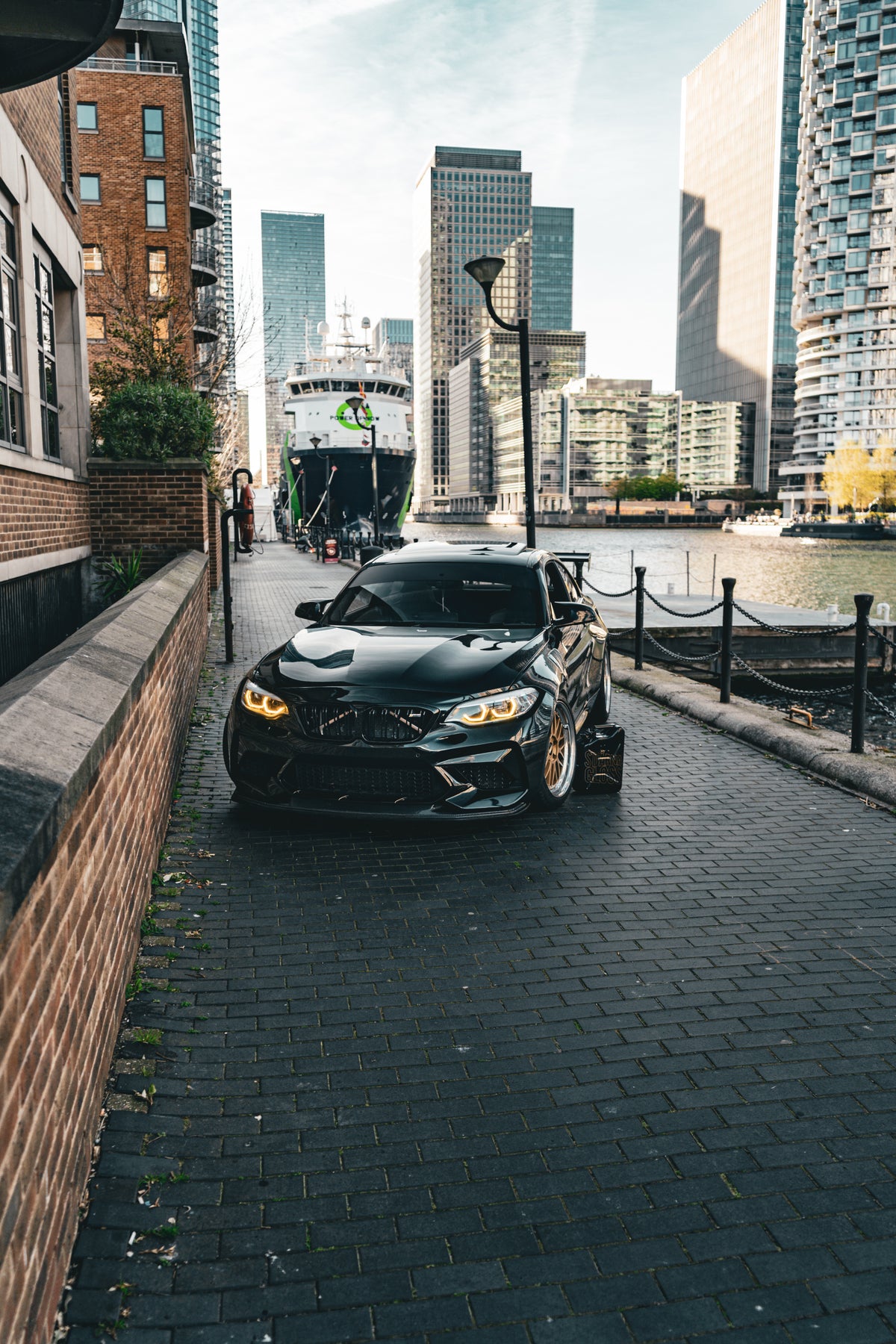 72Design Carbon GTS front splitter installed on BMW M2 Competition, showcasing aerodynamic design and high-performance vehicle enhancement.