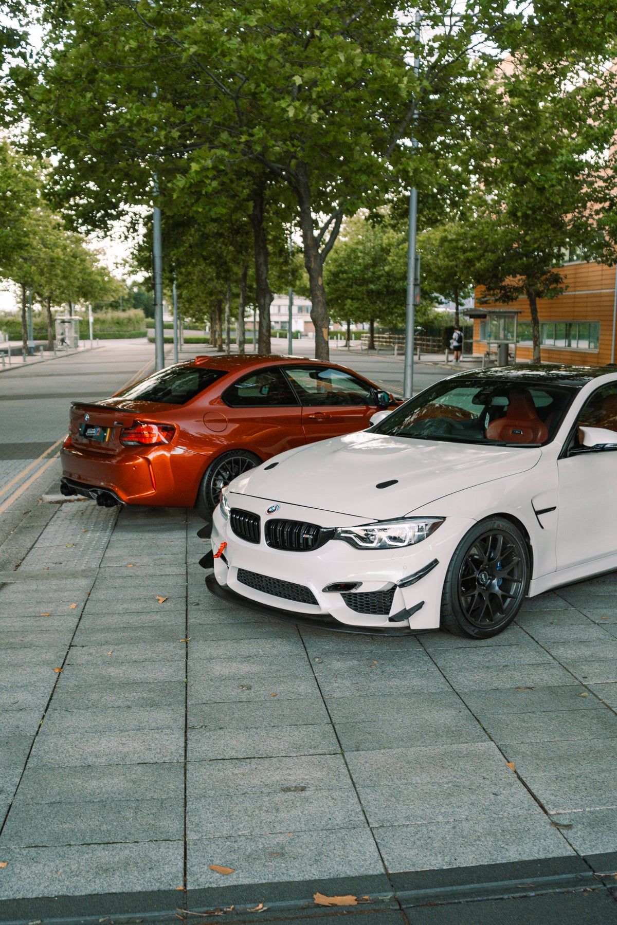 Nineteen72 Performance Carbon GT4 side canards for BMW M3 F80 and M4 F82 front bumper trim, showcasing sleek carbon fiber design.
