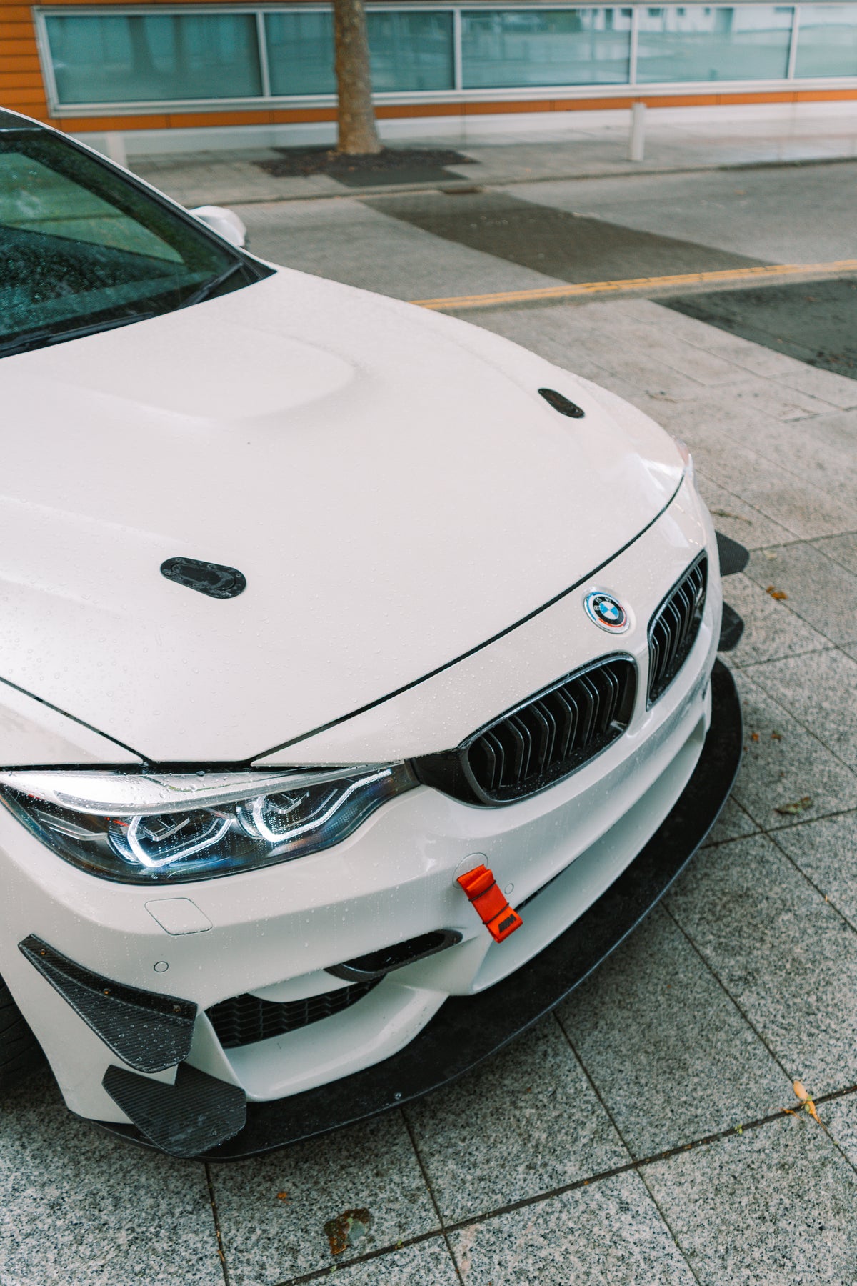 Nineteen72 Performance Carbon GT4 side canards for BMW M3 F80 and M4 F82, front bumper trim with aerodynamic design.