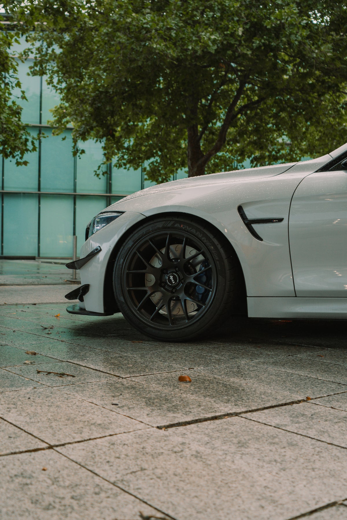 Nineteen72 Performance Carbon GT4 Side Canards for BMW M3 F80 and M4 F82 front bumper trim, shown on a vehicle.