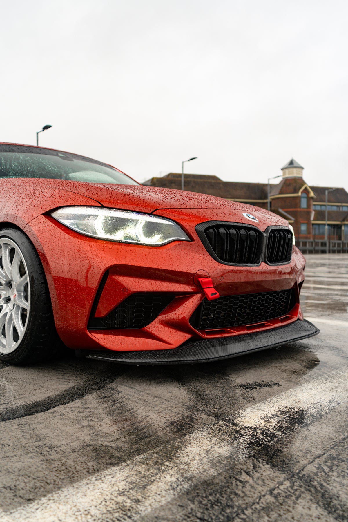 Ridgeline Motorsport carbon fibre GTS front splitter for BMW M2 Competition F87, showcasing aerodynamic design and high-quality material.