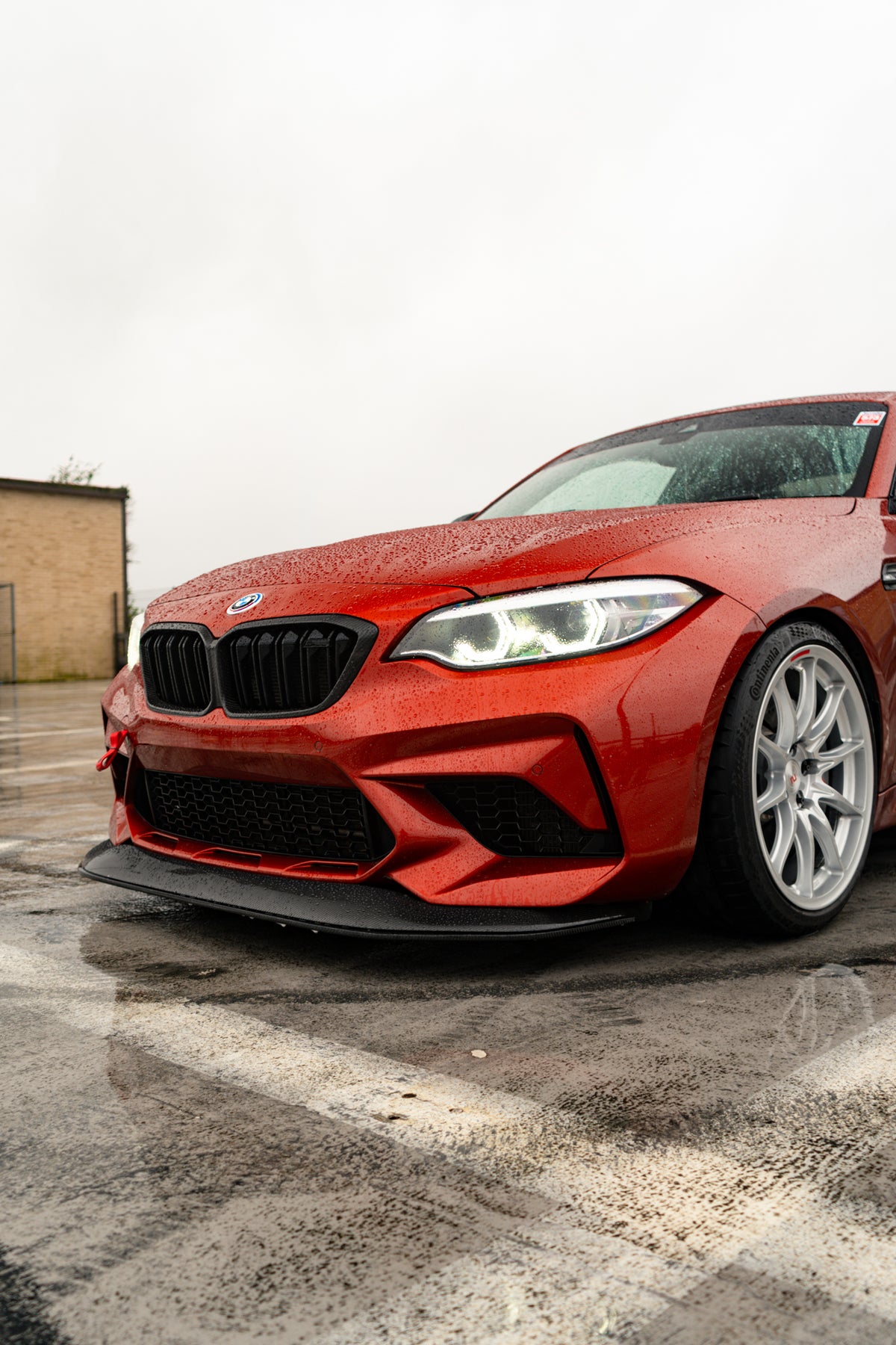 Ridgeline Motorsport carbon fibre GTS front splitter for BMW M2 Competition F87, showcasing the aerodynamic design and finish.