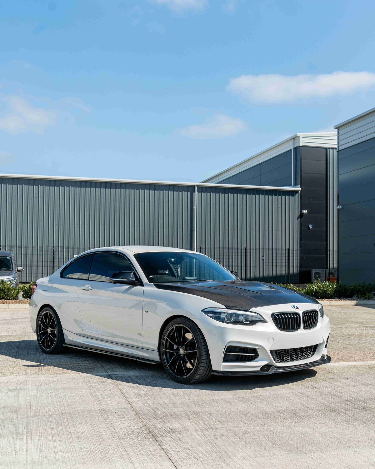 BMW M2 F87, M2C, F20, F22 1 & 2 Series carbon fibre bonnet by CT Carbon, showing sleek, lightweight hood with detailed weave pattern.