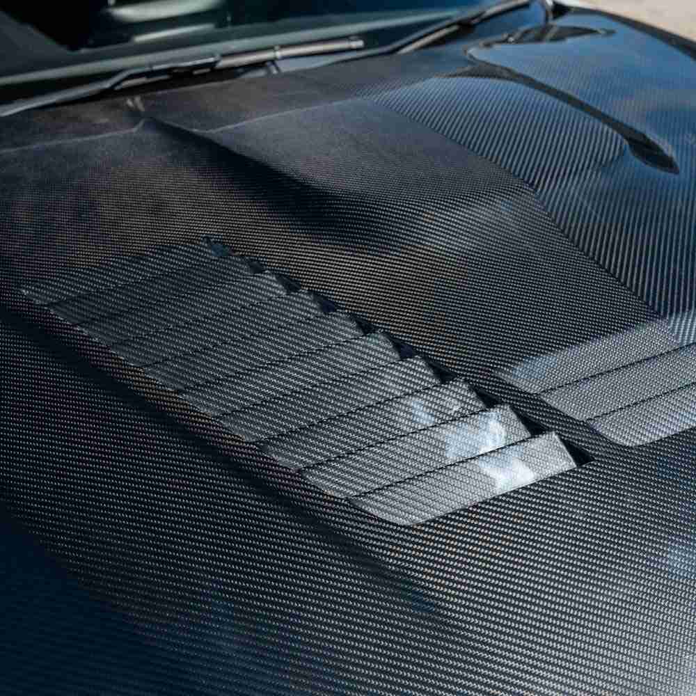 BMW M2/M2C F87 & F20/F22 1 Series carbon fibre bonnet by CT Carbon, showing sleek, lightweight hood with textured carbon fiber surface.