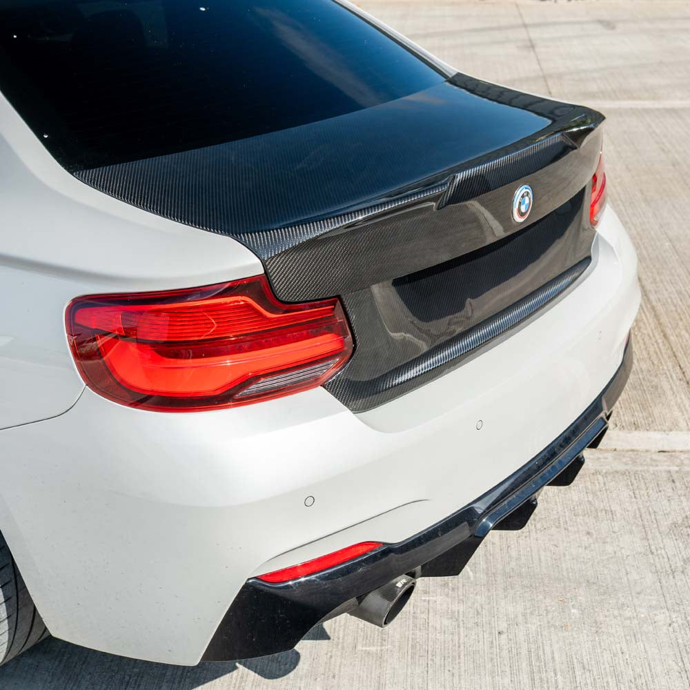 BMW M2 F87 carbon fibre bootlid by CT Carbon, showcasing sleek, lightweight design with a smooth finish on the car's rear.