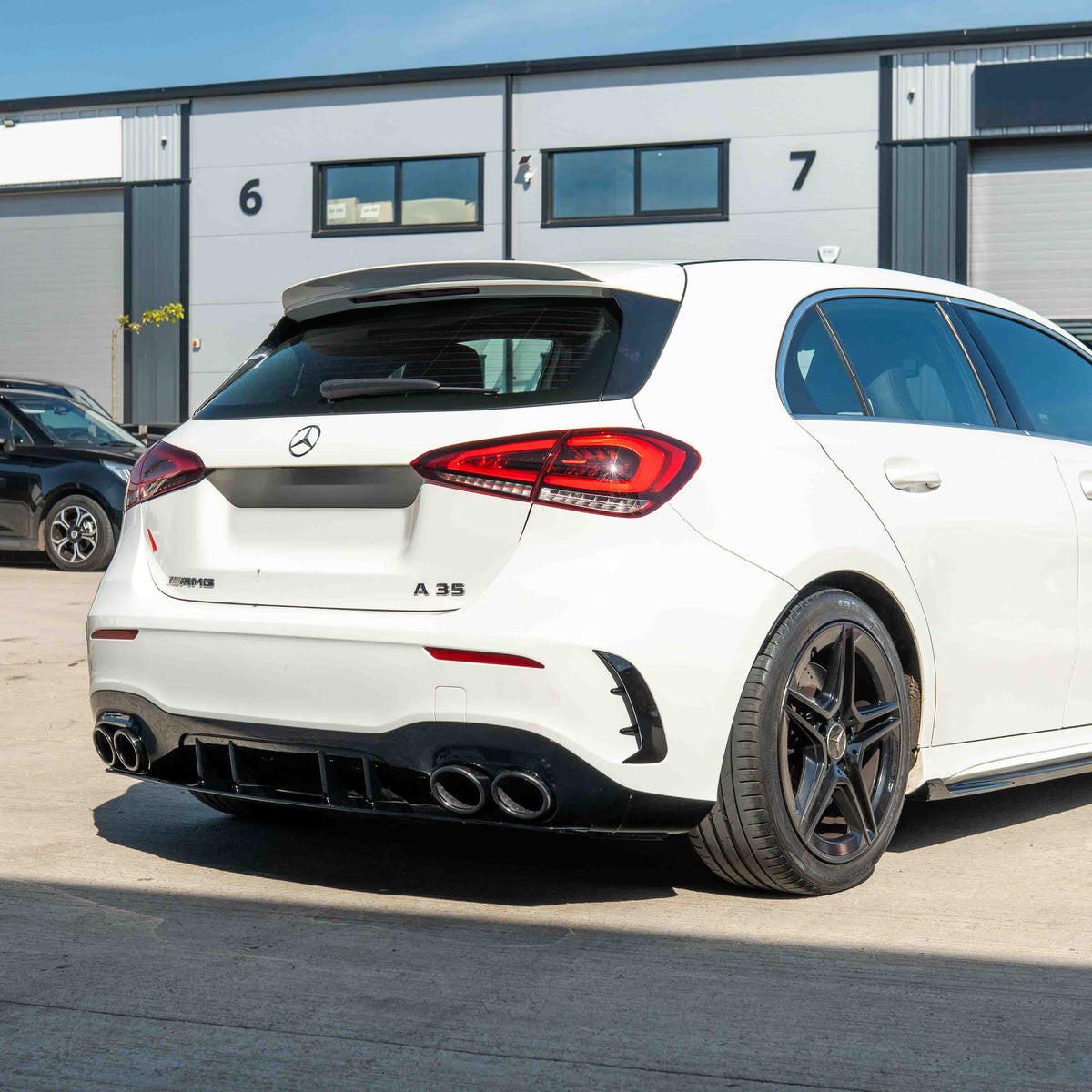 CT Carbon Mercedes A-Class W177/V177 2018-current gloss black quad tip diffuser installed on the rear of the vehicle.