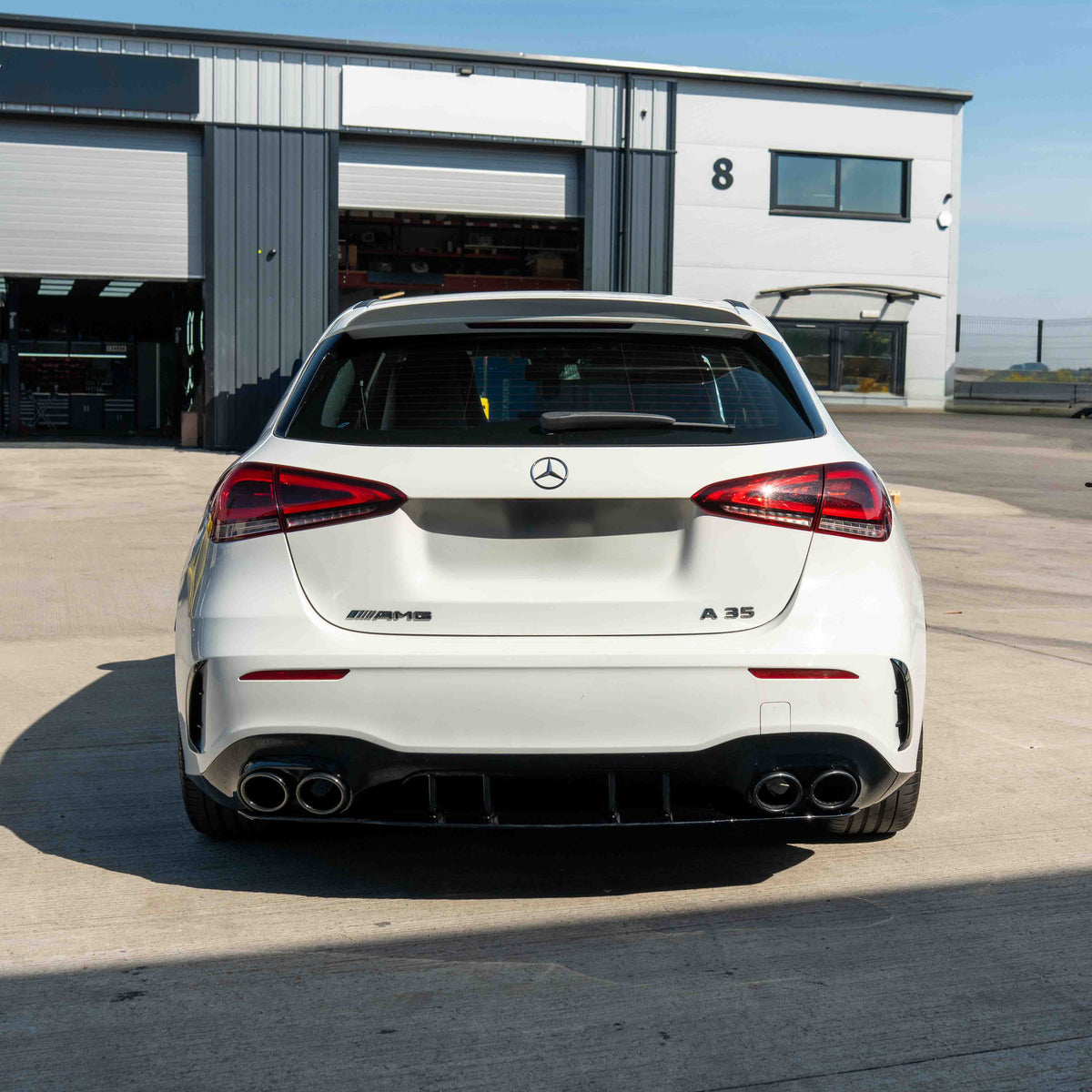 CT Carbon Mercedes A-Class W177/V177 2018-current gloss black quad tip diffuser installed on the rear of the vehicle.