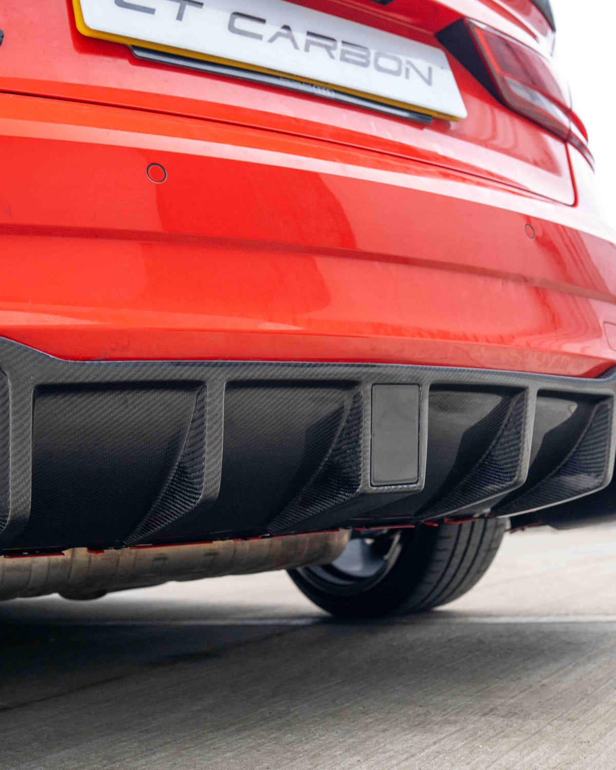 Audi RS3 8V saloon rear carbon diffuser with DTM light by CT Carbon, showcasing sleek automotive styling and aerodynamic design.