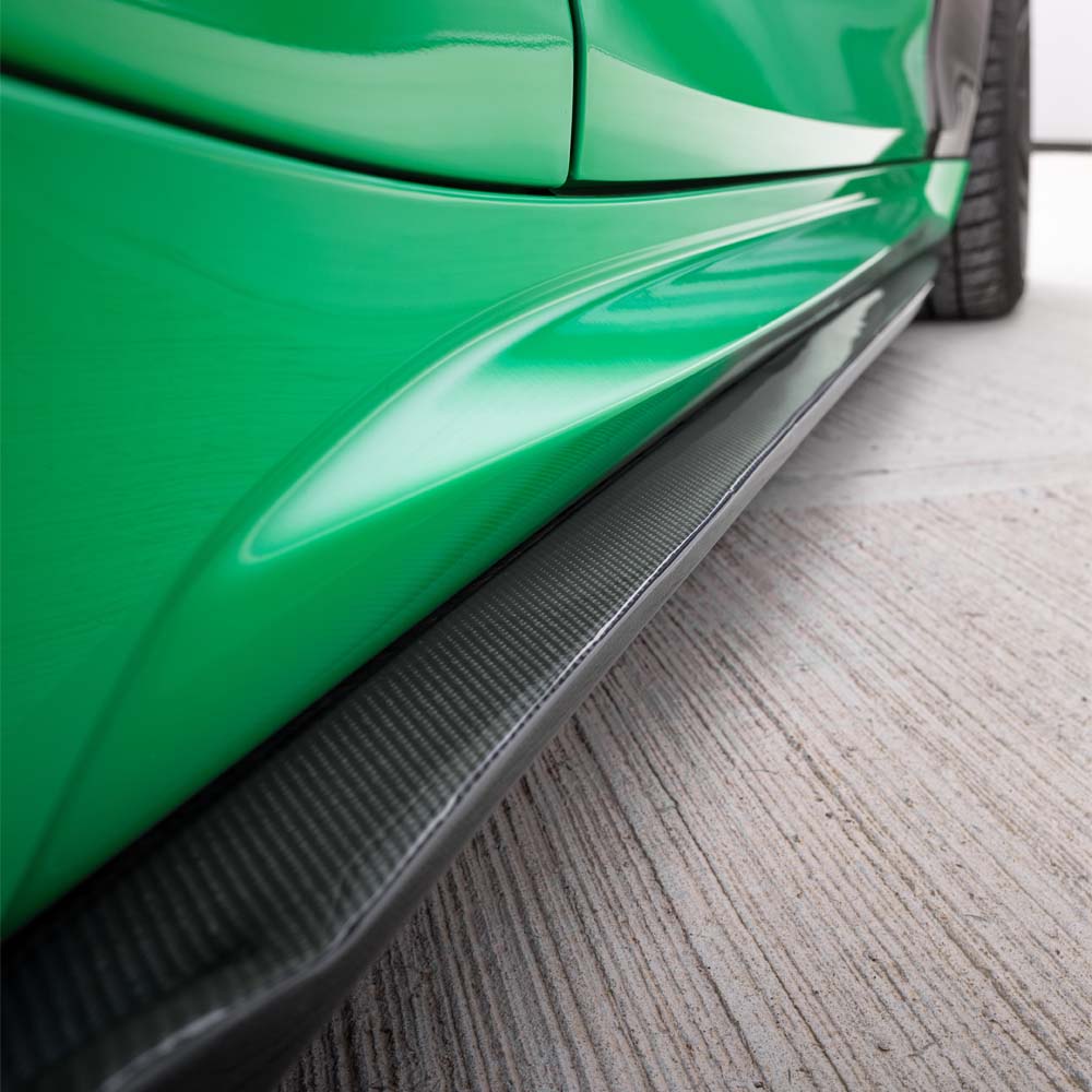 BMW F87 M2 Carbon Fibre Ultimate Kit by CT Carbon, including body panels and accents, assembled on the car's exterior.