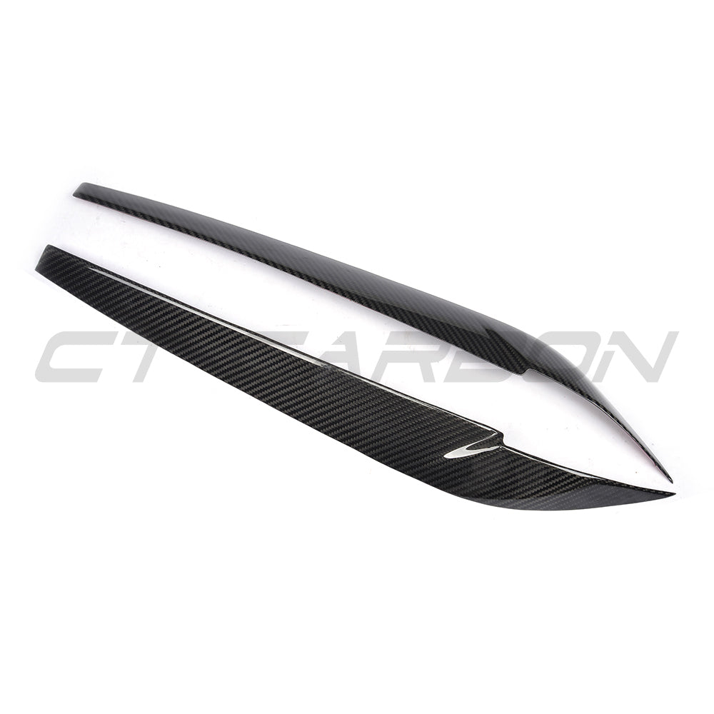BMW F15/F16 X5/X6 2014-2018 Carbon Fibre Headlight Eyebrows by CT Carbon, close-up view showing sleek design details.