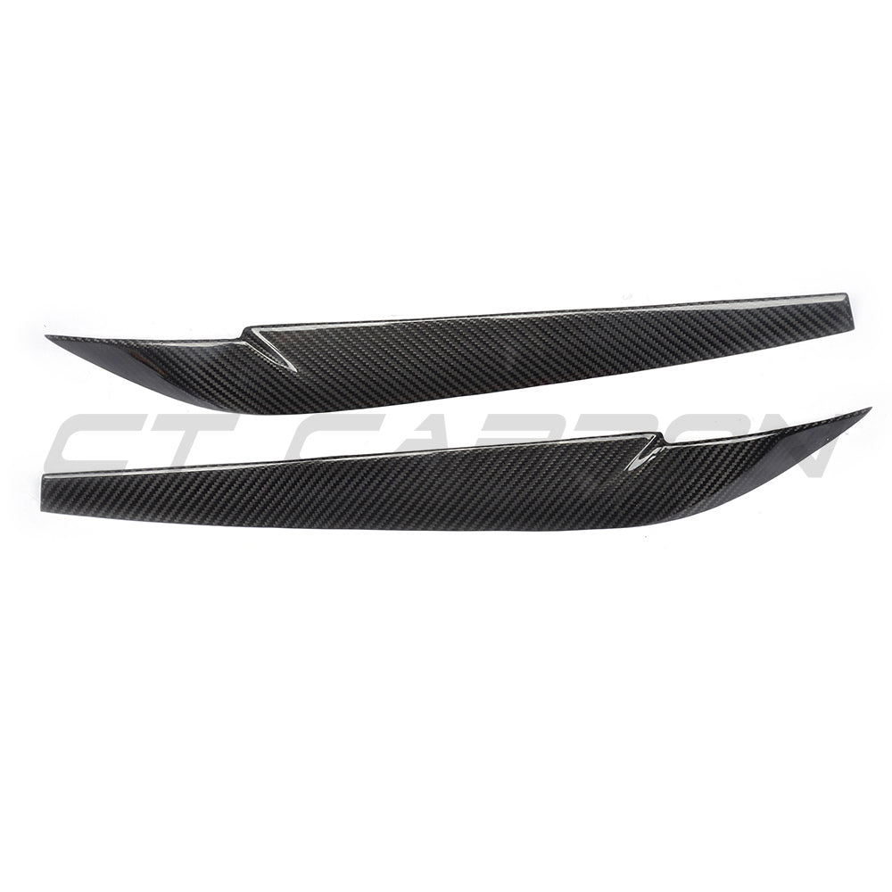 BMW F15/F16 X5/X6 carbon fibre headlight eyebrows accessory by CT Carbon, shown on a vehicle's front headlights.