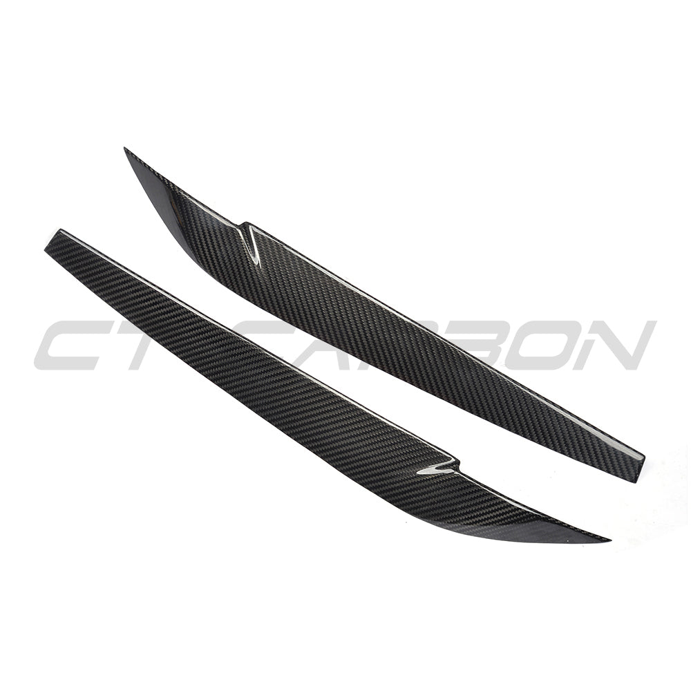 BMW F15 F16 X5 X6 2014-2018 carbon fibre headlight eyebrows by CT Carbon, showing stylish automotive accessory with a glossy finish.